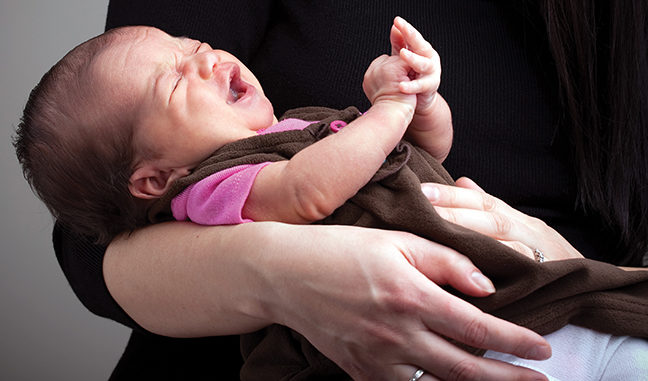 Mother Holding a Screaming Baby