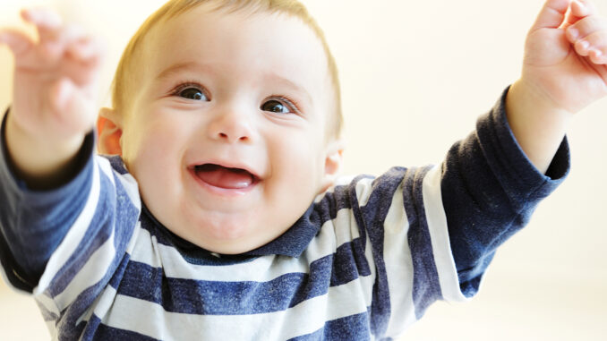 Beautiful smiling cute cheerful baby